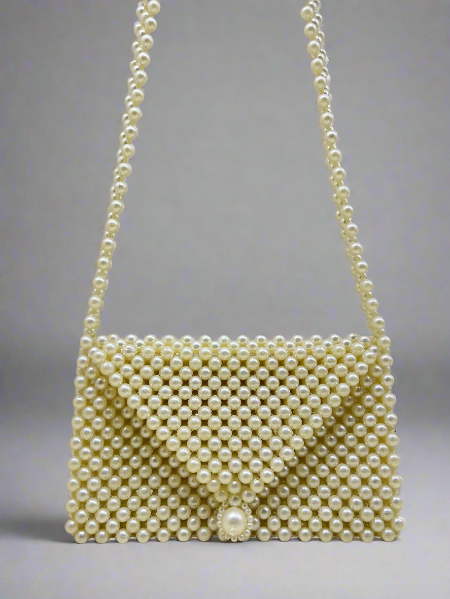 Handmade pearl bags are made of pearl, which is shiny and luxurious in the sun. We string all the  together by hand. Our exquisite and elegant bags are firm and they don't deform easily.